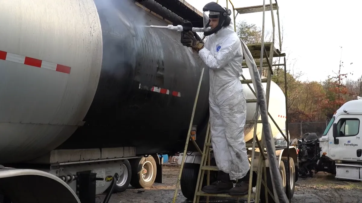 Carolina Industrial technician dry ice blasting a tanker trailer